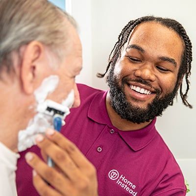 Caregiver helping shave