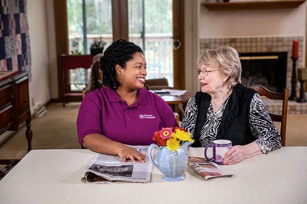 caregiver with newspaper