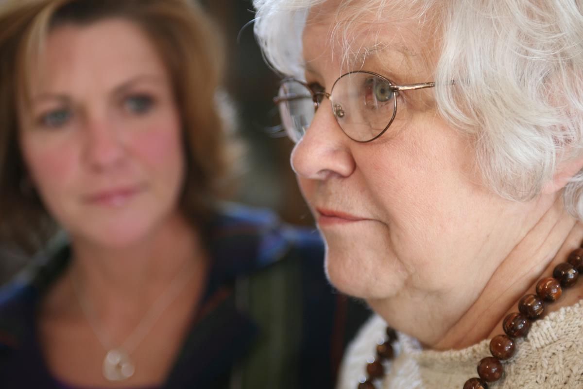 woman looking at older woman