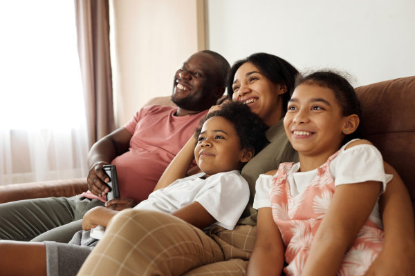 family sitting on a couch. 