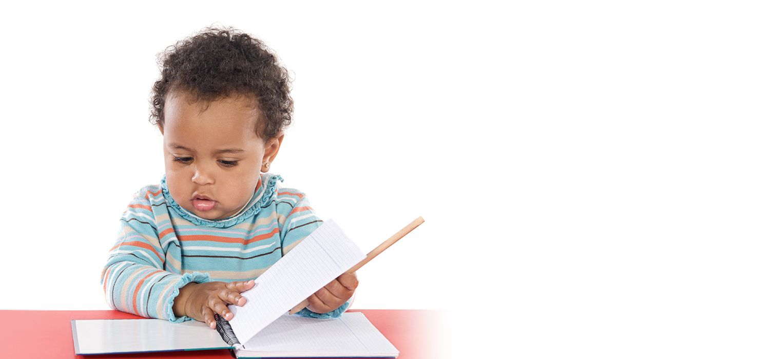 toddler looking at a notebook