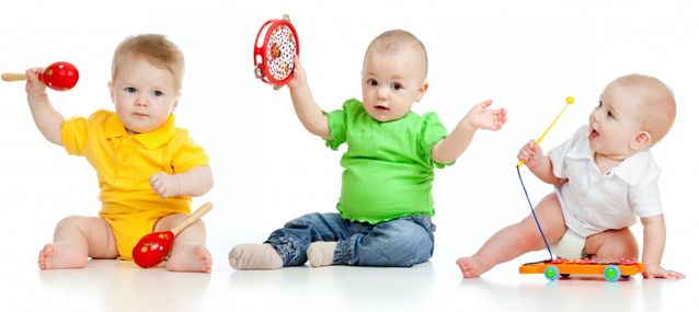 three infants playing with musical instruments