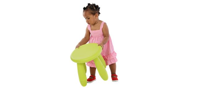 toddler moving a small table