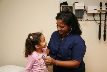 doctor giving a child a checkup