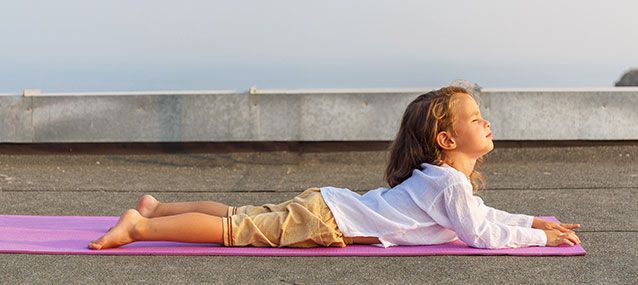 child practicing yoga