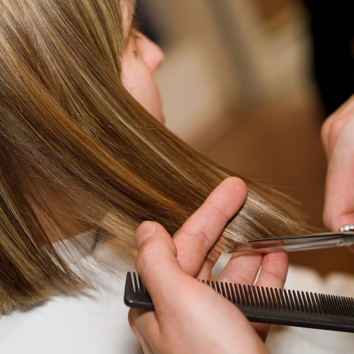 girl getting hair styled