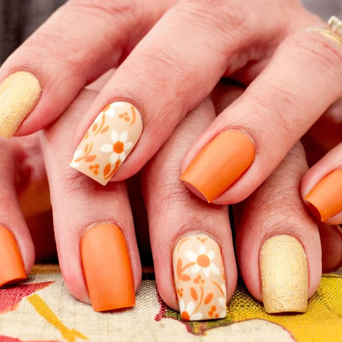orange, yellow and flower designed nails
