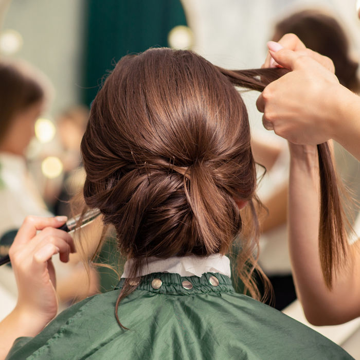 wedding hair being styled.