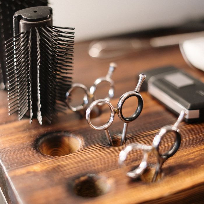 hairdressing equipment in a wooden holder