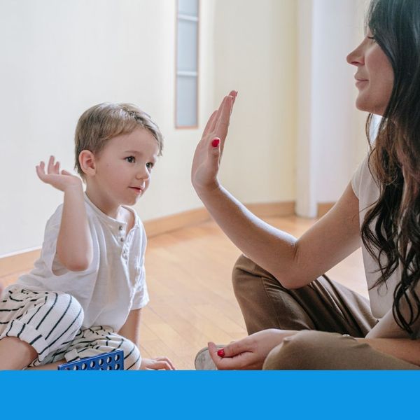 mother high-fiving child mother high-fiving child