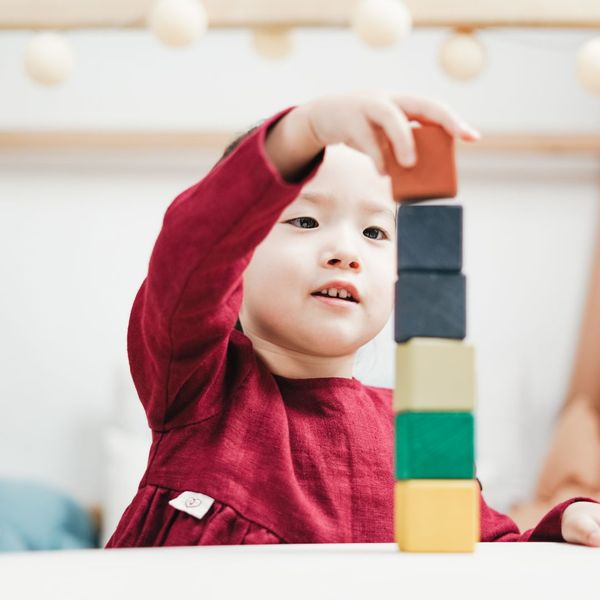 child with building blocks