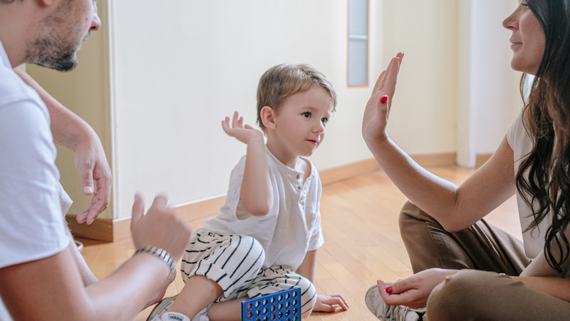 kid giving a high five