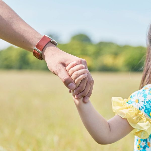 Parent holding a child's hand. Parent holding a child's hand.