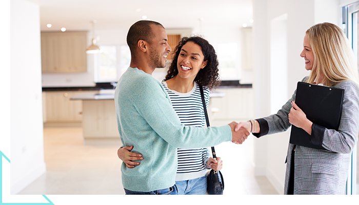 couple speaking to a realtor