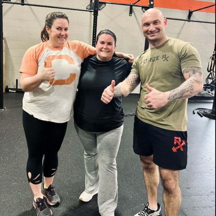 Forge-Rx trainer with two female clients
