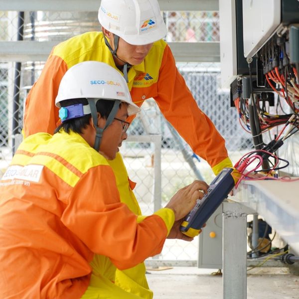 Two electricians working
