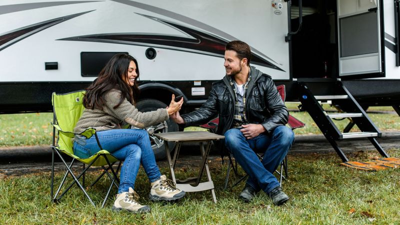 couple in front of rv