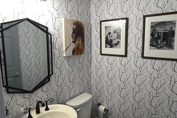 Bathroom with grey custom wallpaper