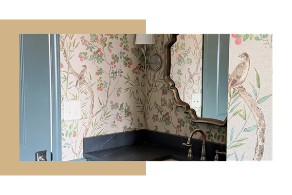 Mirror and sink with an elegant bird and tree wallpaper design