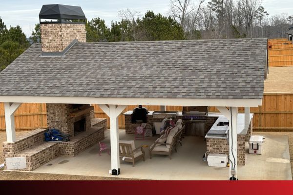 pavilion with a kitchen and fireplace