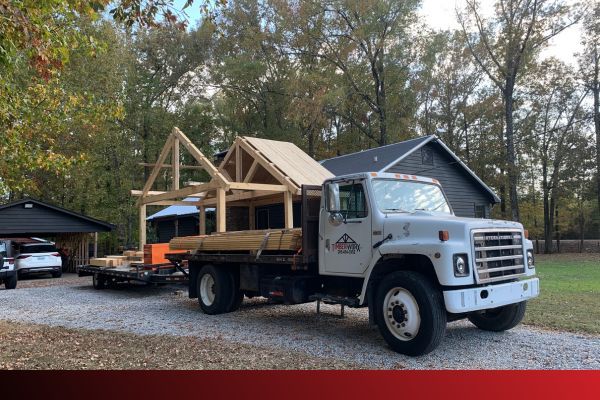 a truck carrying a crafted wooden roof