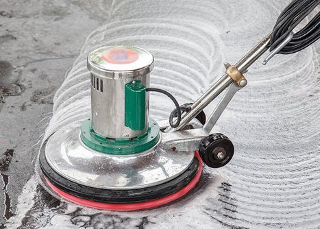a buffing machine on a concrete floor