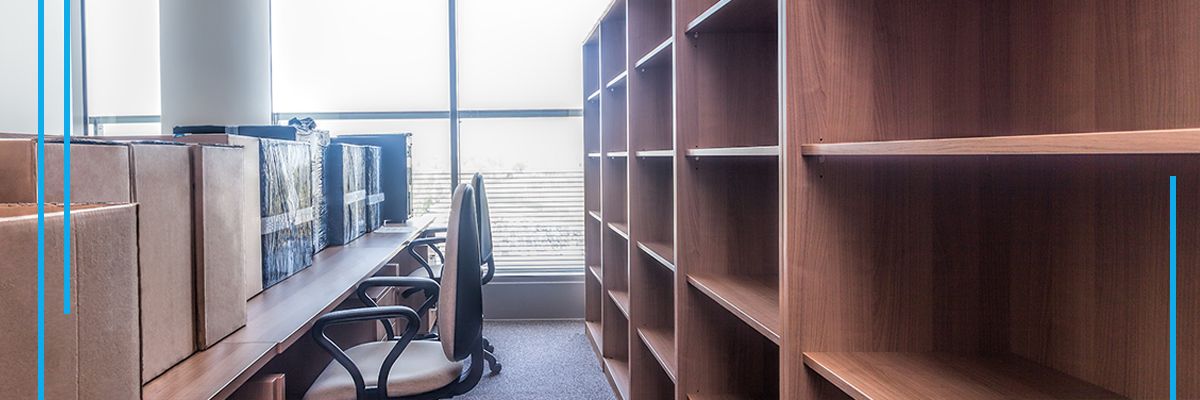 Office with packed moving boxes