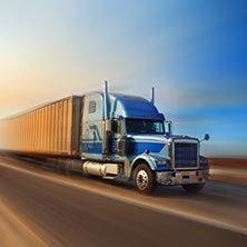 Semi truck driving down a highway