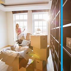 Woman packing boxes for a move