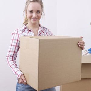 Woman holding a moving box