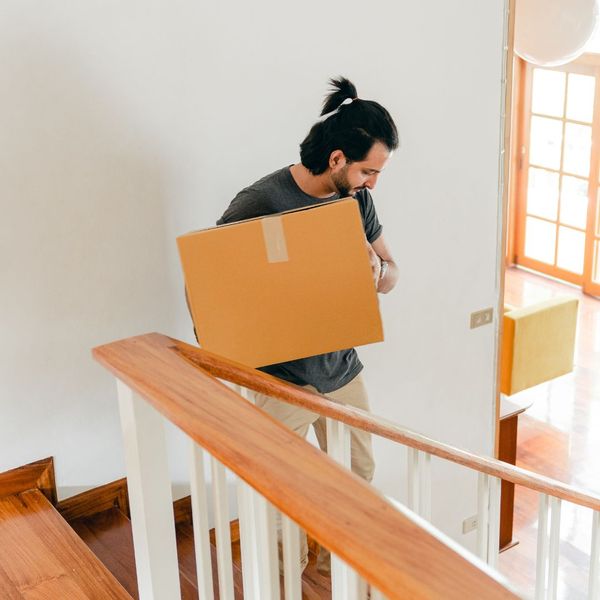 man carrying moving box