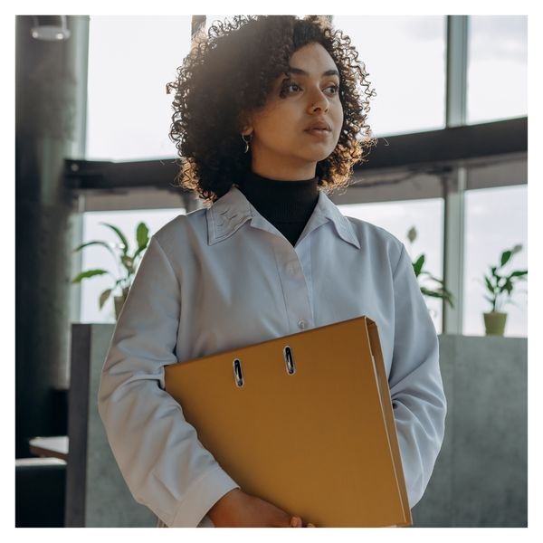 Woman holding a binder