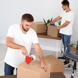 Movers packing boxes