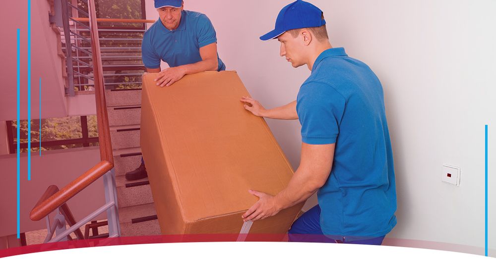 Movers moving a large box down stairs