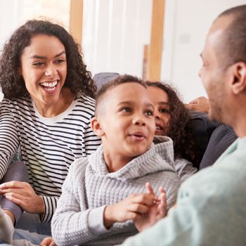 Happy family sitting on a couch