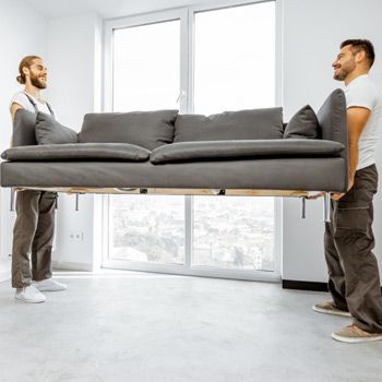 Movers moving a couch