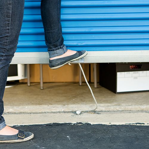 Woman placing her items in storage