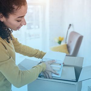 Woman packing boxes