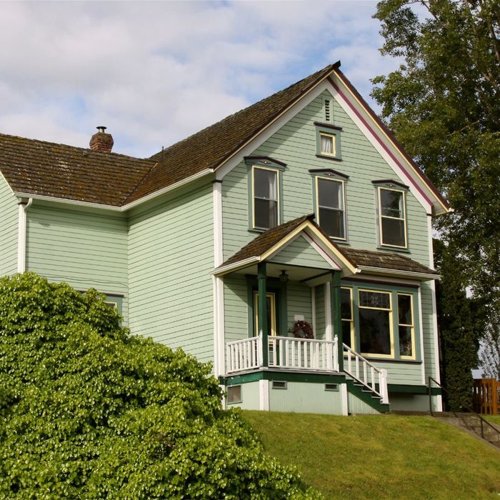 A beautiful home with old exterior paint