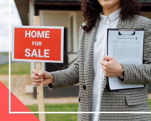 realtor holding sign 