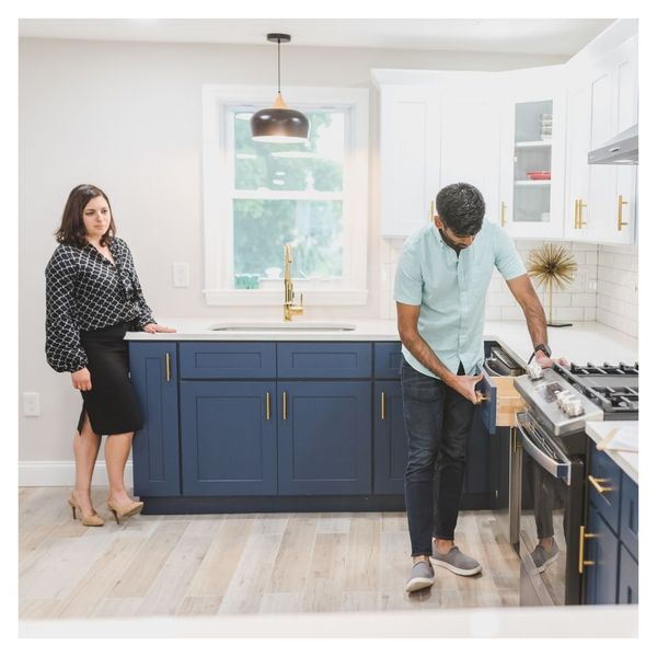 future home buyer looking at kitchen