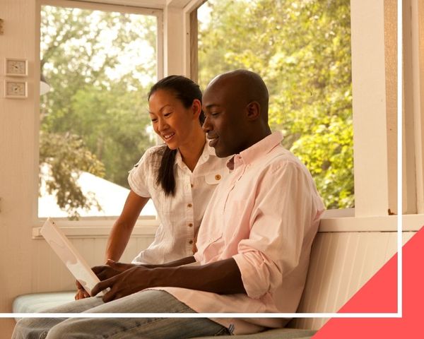 couple looking at different neighborhoods online