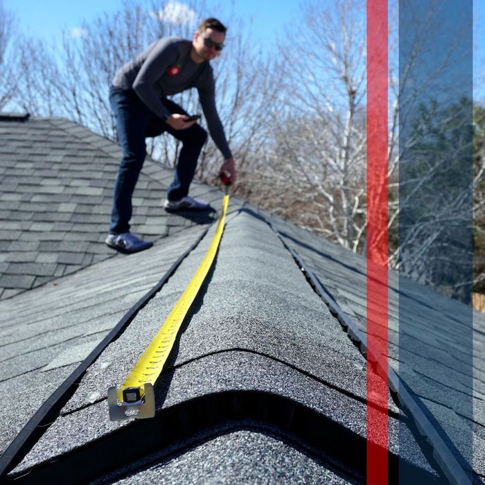 person measuring tiles on roof