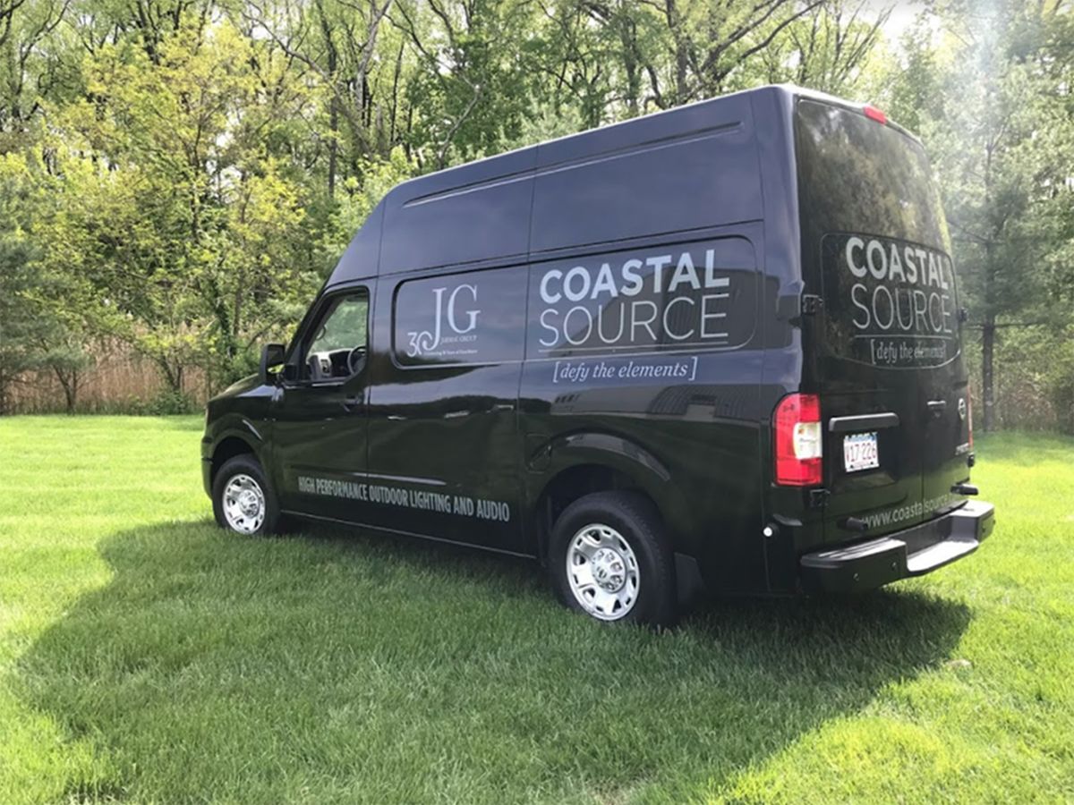 Image of a Coastal Source outdoor lighting and audio delivery van.