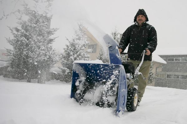 Man snowplowing