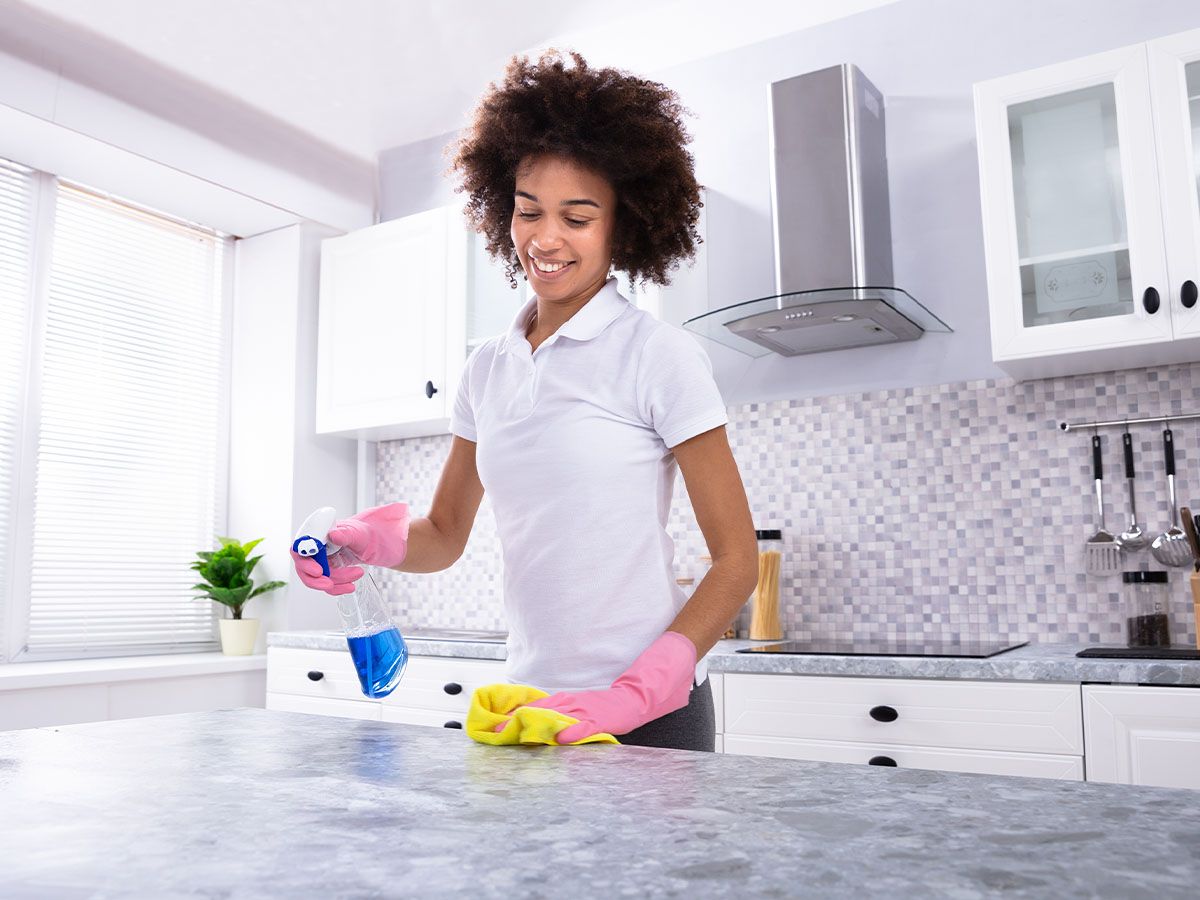 woman cleaning counter