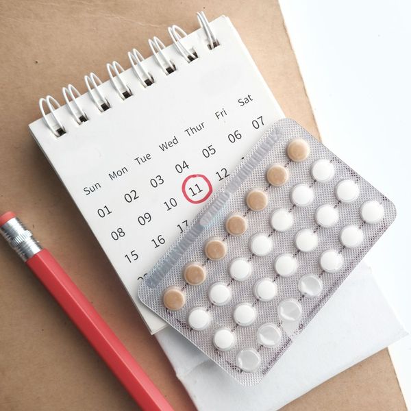 birth control pills and a calendar