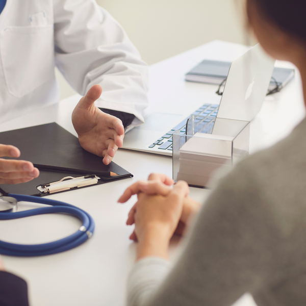 Woman speaking to a doctor