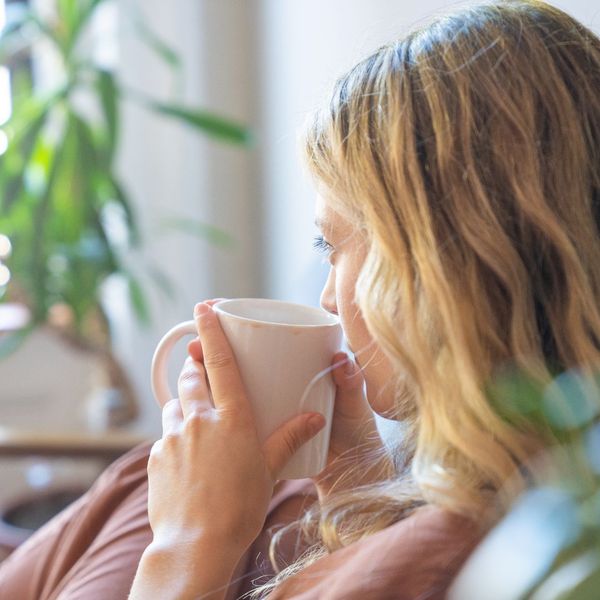 woman drinking coffee at home