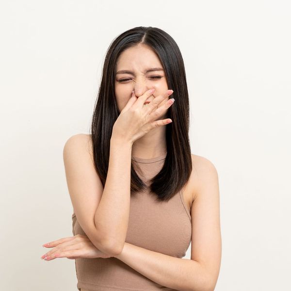 woman smelling a strong urine odor